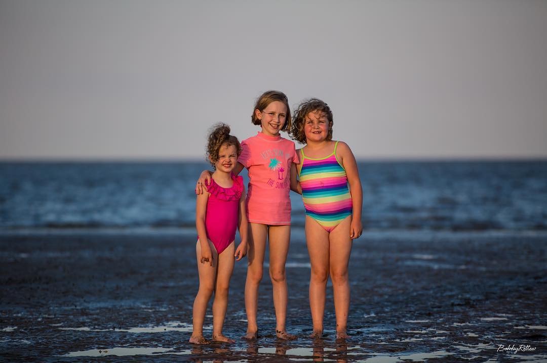 That is three little beach girls enjoying searching for crabs during low tide here on St. Helena Island outside Beaufort!