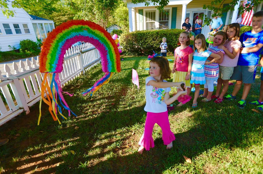 Yes...our front yard was transformed into #CandyLand as #Rosebud took a swing at the piñata! #CanonBringIt #5Dmkiii #tw