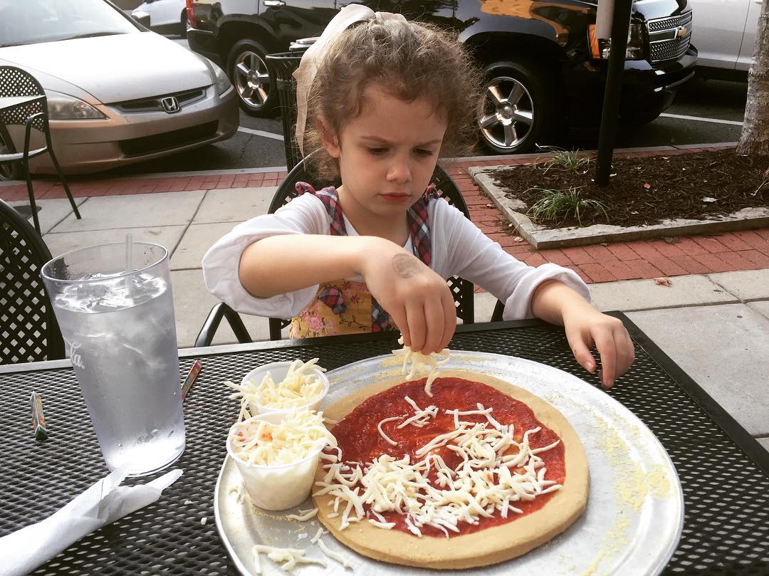 Making your own pizza takes concentration and precision! #Rosebud #DaddyDateNight #tw